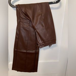 Brown faux leather flared pants in brown